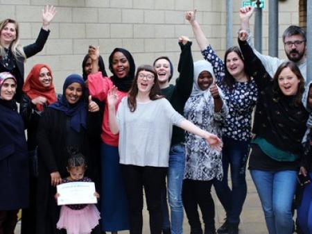 Cheering to celebrate a well run refugee and migrant training course in Bristol